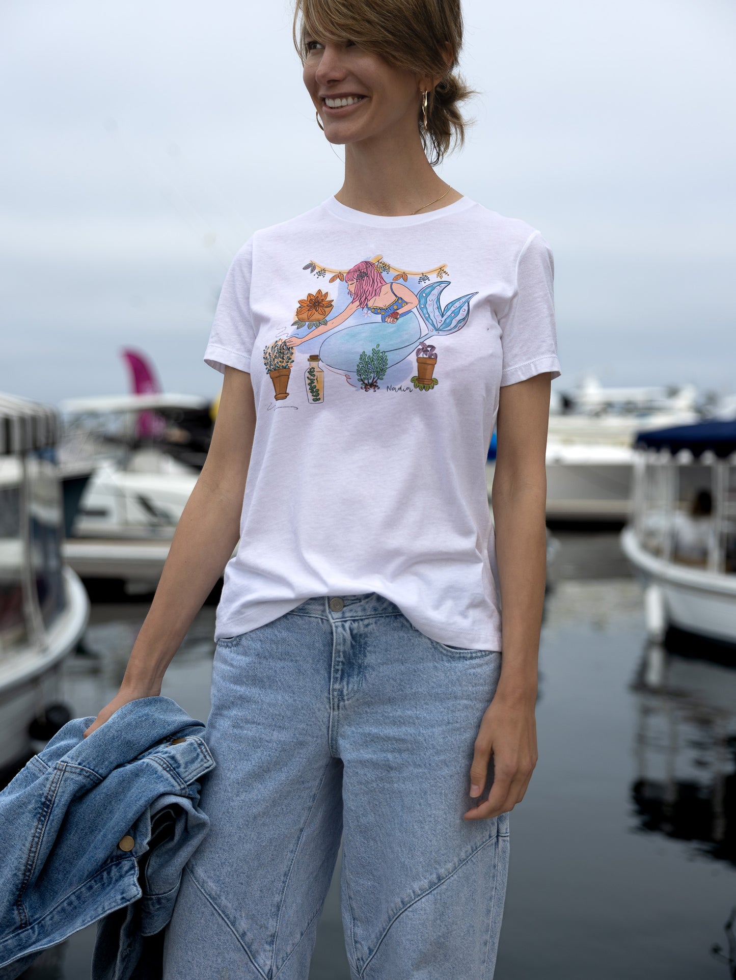 Pink-haired mermaid tee 🌊✨ Hand-illustrated design featuring a mermaid nurturing herbs, symbolizing growth and harmony between ocean and earth.