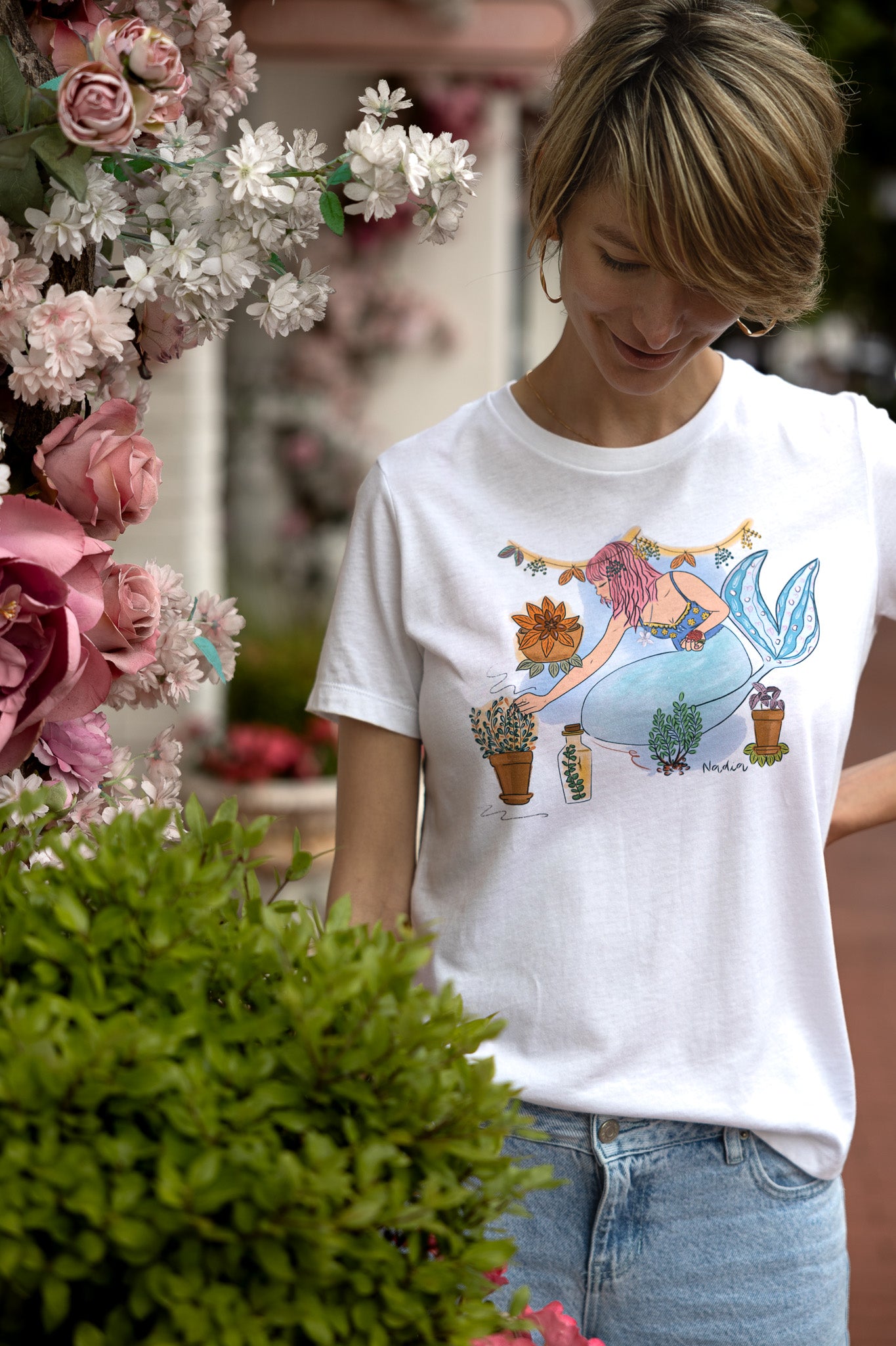 Mermaid tee featuring a hand-illustrated design of a pink-haired mermaid surrounded by herbs