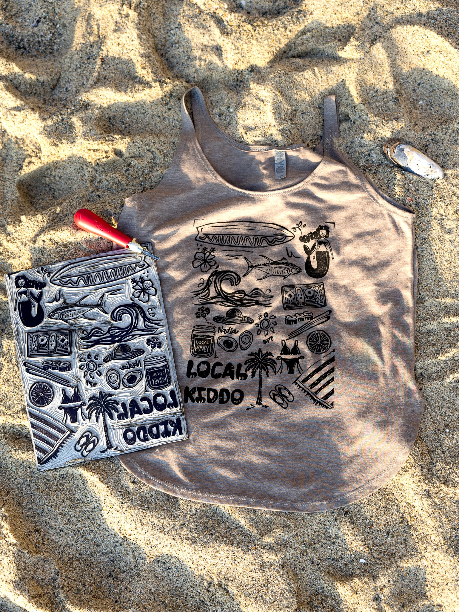 Sun-kissed sand colored tank top with linoleum block-printed Southern California design