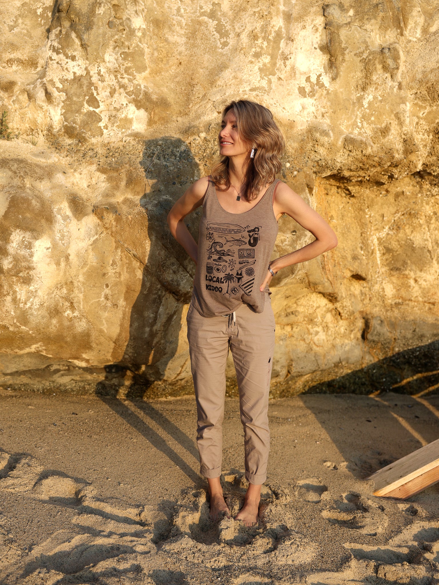 Sun-kissed sand colored tank top with linoleum block-printed Southern California design