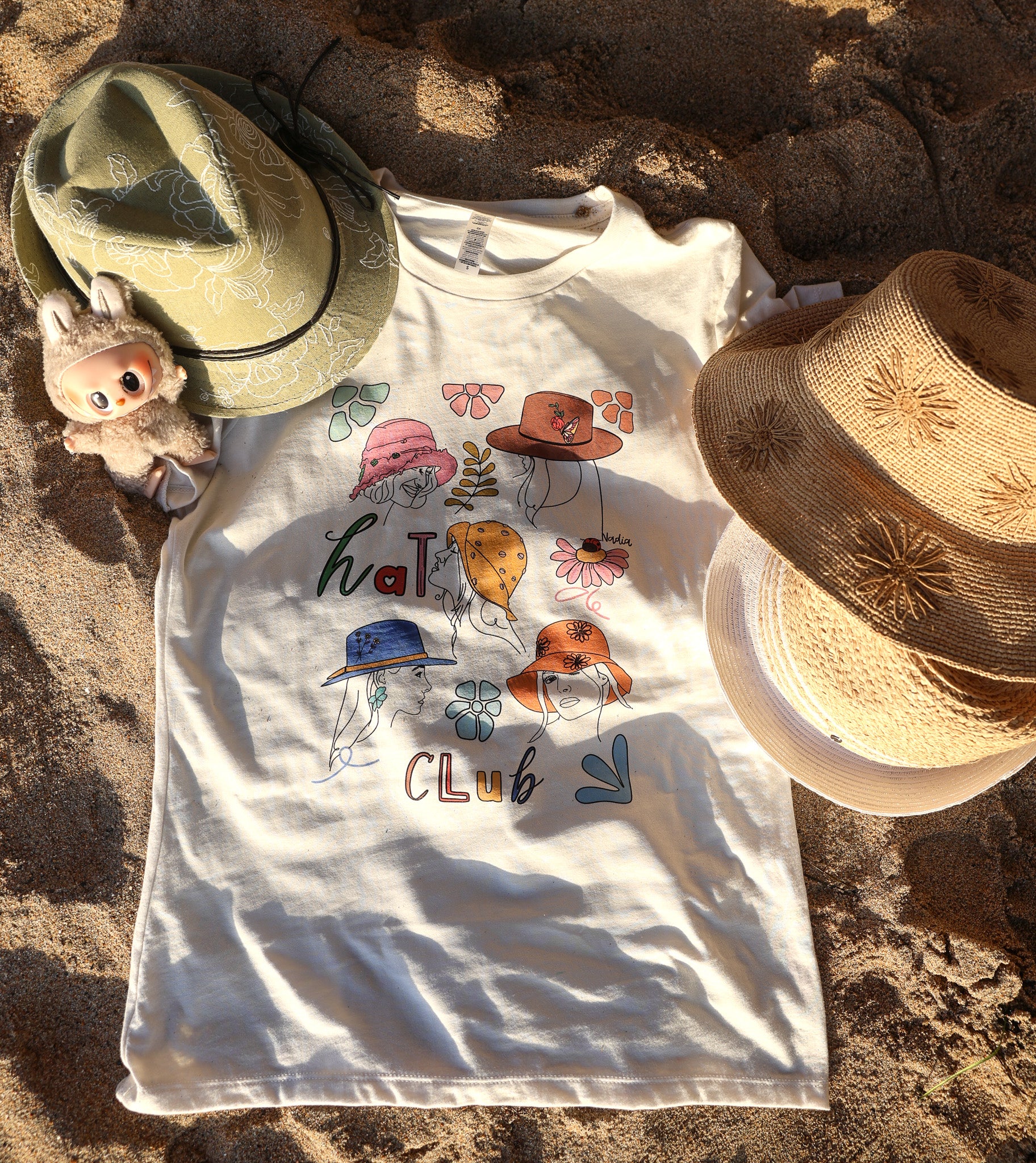 HAT CLUB graphic tee with hand-illustrated design