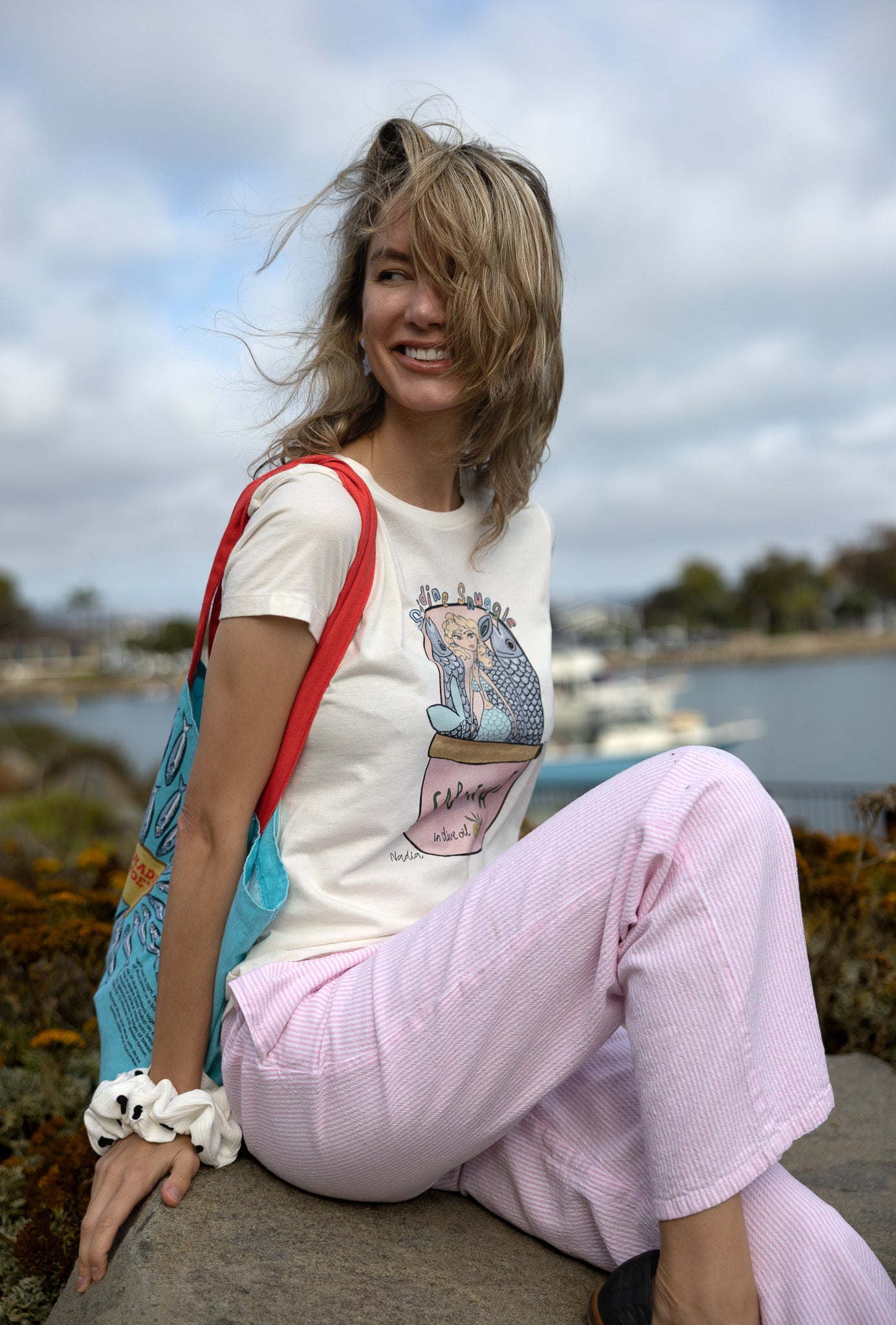 Hand‑illustrated mermaid snuggled in a sardine can on a soft cotton women’s tee – Southern California vibe