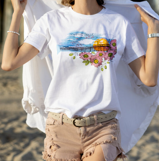 Soft women's tee featuring a hand-drawn design of Newport Beach Pier on 100% premium cotton.