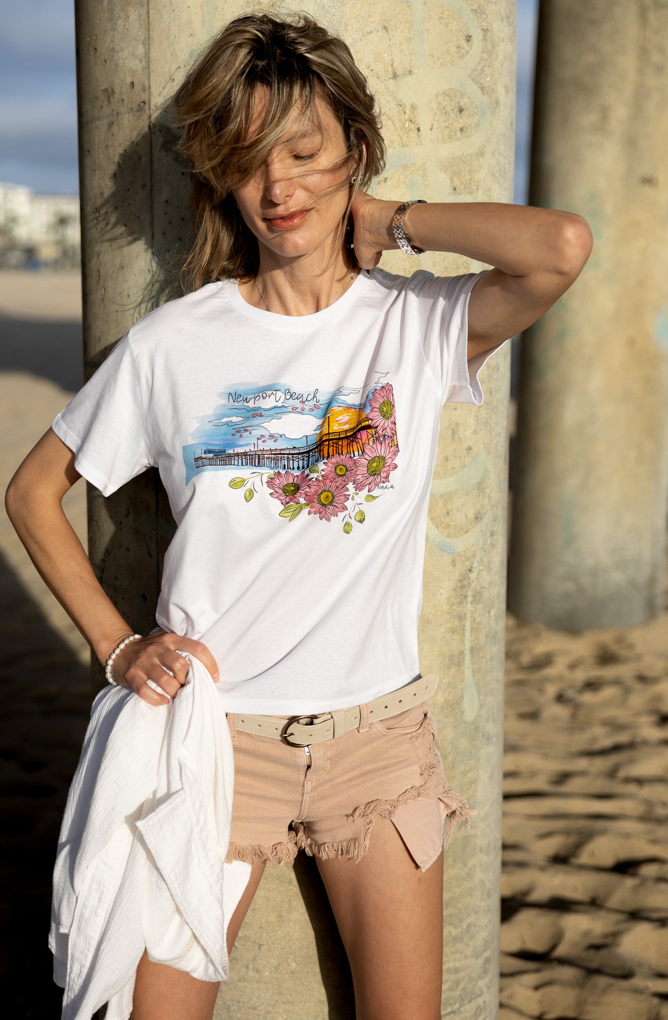 Soft women's tee featuring a hand-drawn design of Newport Beach Pier on 100% premium cotton.