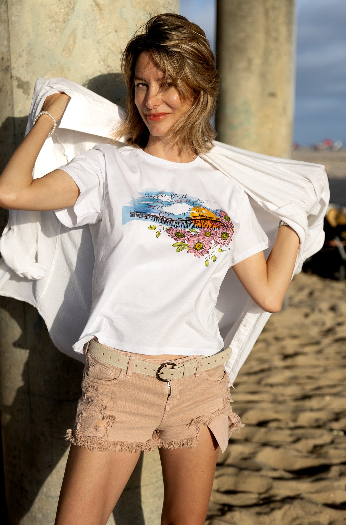 Soft women's tee featuring a hand-drawn design of Newport Beach Pier on 100% premium cotton.