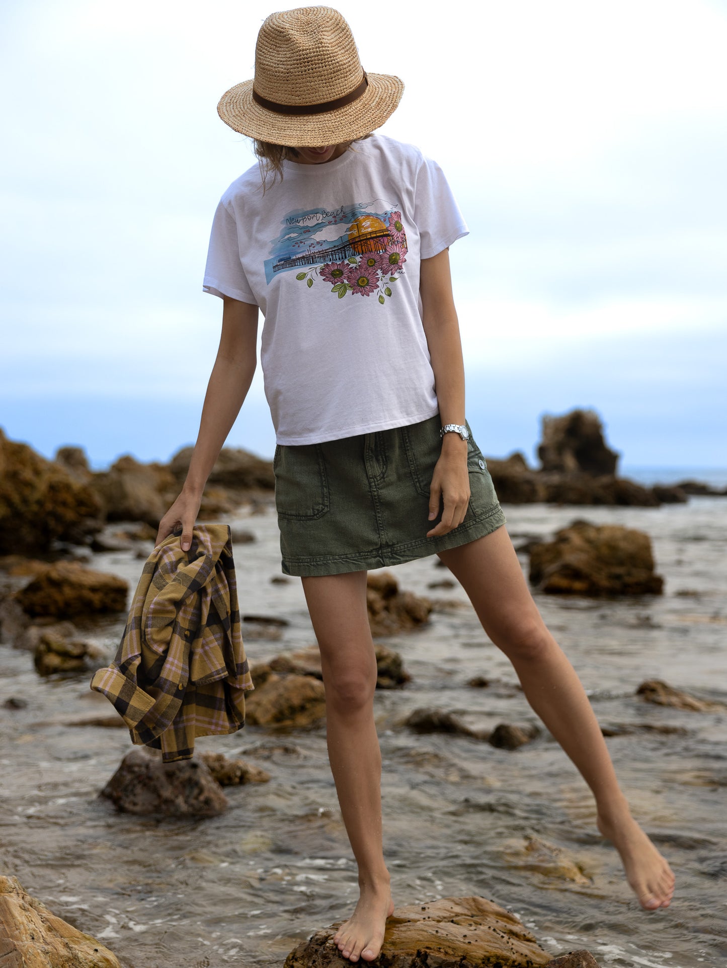 Handmade graphic t-shirt for women by North Shore Girls. Illustrated Newport Beach Pier with floral vibrant details. Perfect gift for women who love the beach and California