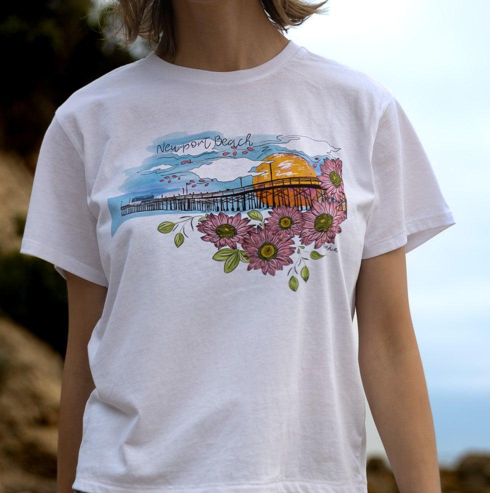 North Shore Girls handmade graphic tee featuring an illustration of Newport Beach Pier