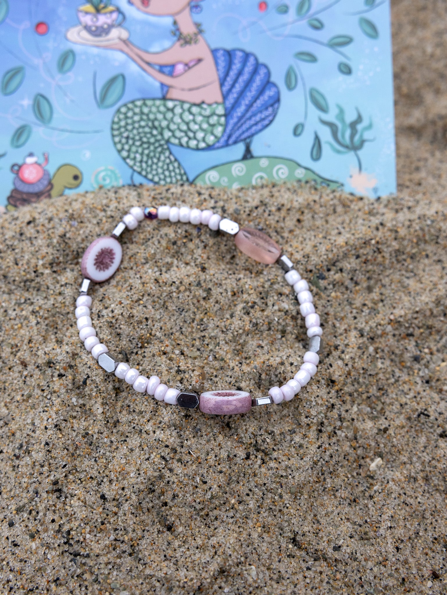 Handmade beach-inspired bracelet with light pink beads