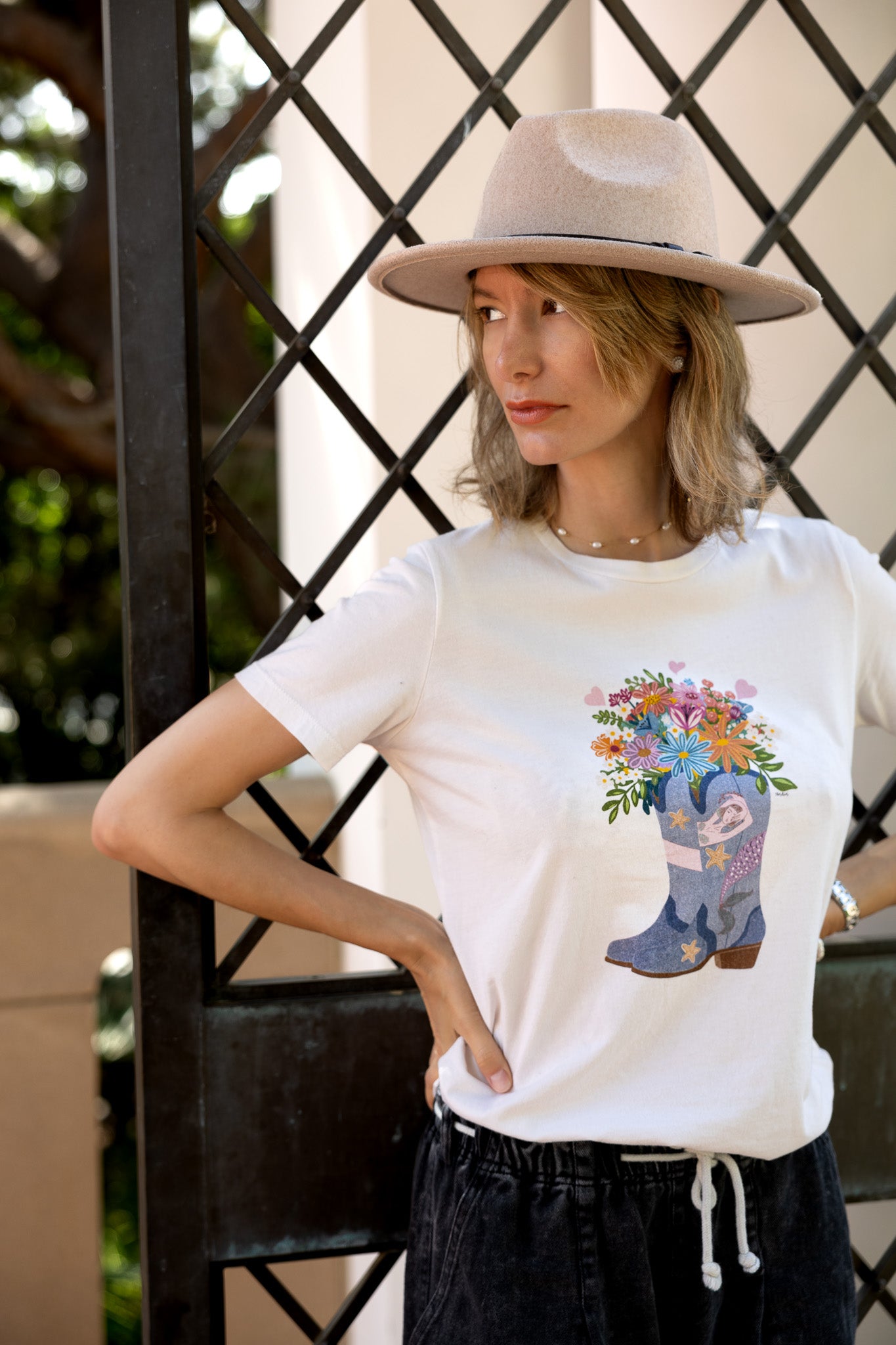 Cowgirl Mermaid illustration tee, women's relaxed fit with mermaid & flower design.