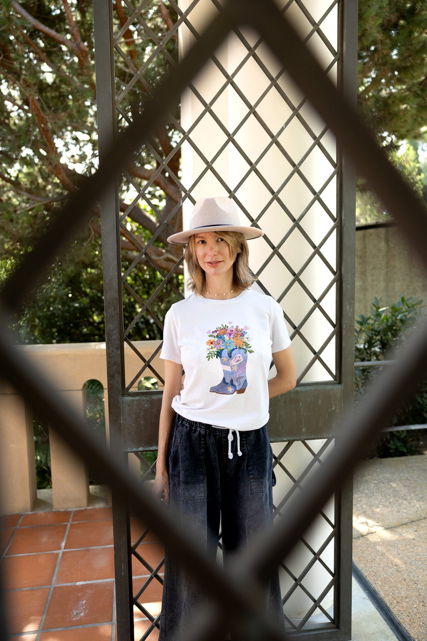 Cowgirl Mermaid illustration tee, women's relaxed fit with mermaid & flower design.