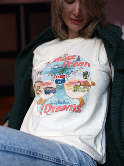 Artist‑illustrated Pacific Coast Highway scene on a soft cotton tee – SoCal vibe