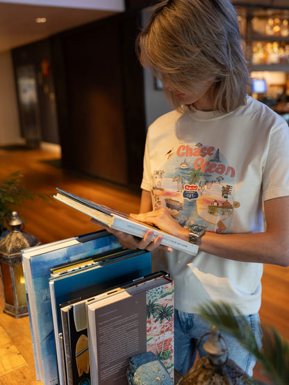 Artist‑illustrated Pacific Coast Highway scene on a soft cotton tee – SoCal vibe