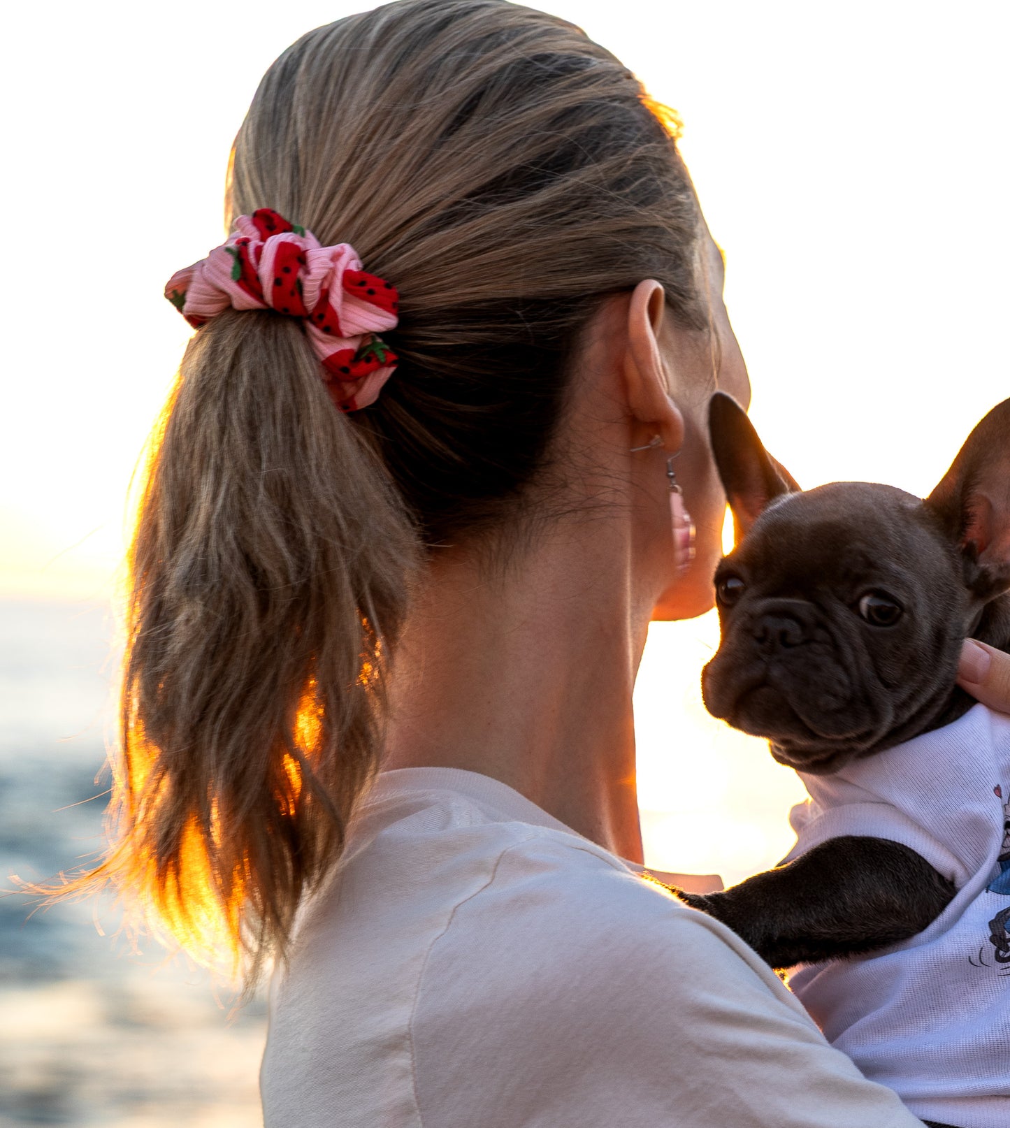 Hand-sewn ribbed scrunchie with a strawberry print and North Shore Girls woven label.