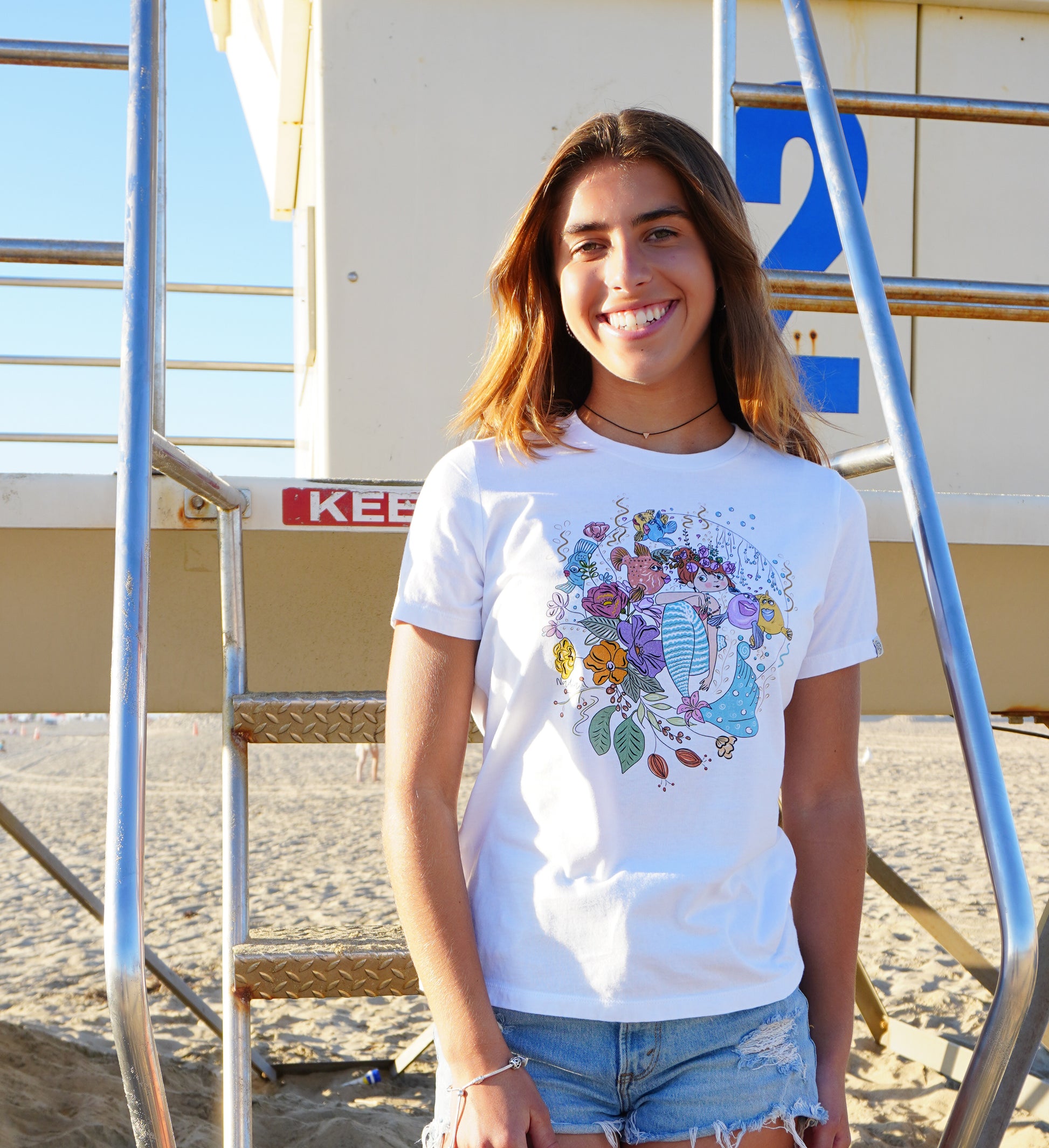 North Shore Girls graphic tee featuring a cute mermaid illustrated by a local artist Nadia Watts