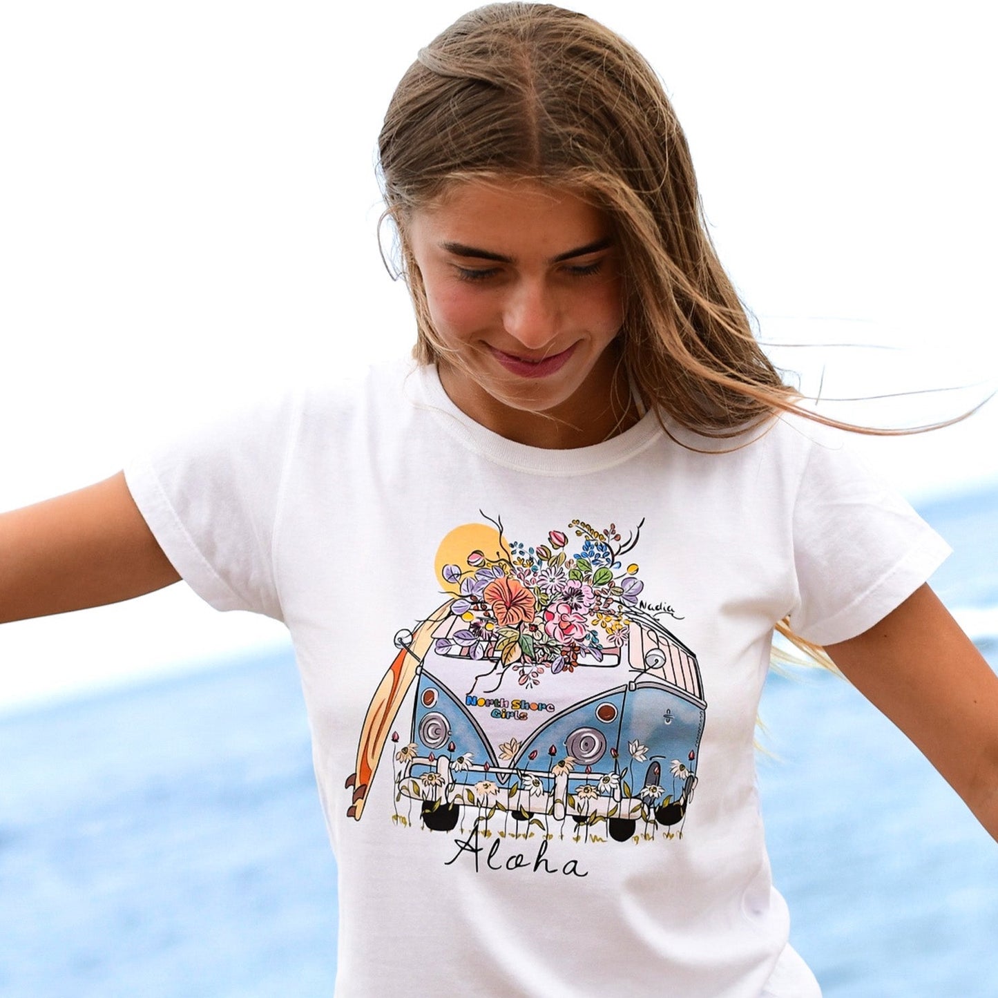 North Shore Girls NSG surf bus illustrated graphic tee for women. floral surf design with surf board graphic
