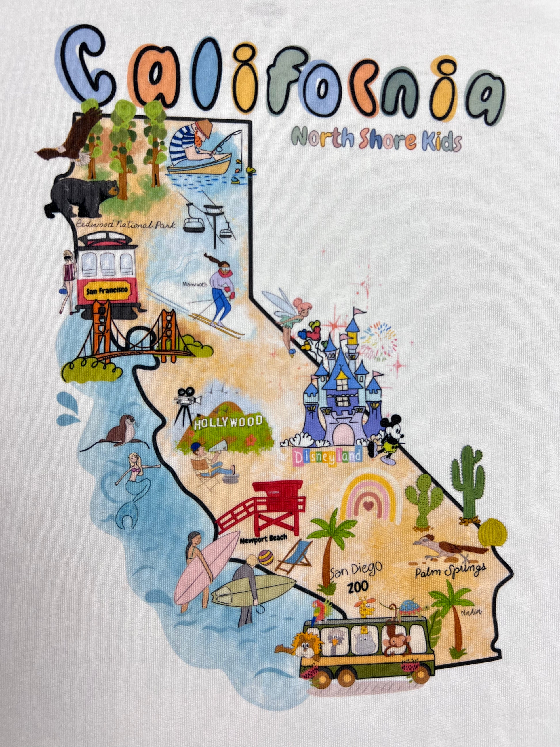 North Shore Girls and Kids illustrated t-shirt for kids. Created by a local artist Nadia Watts. California Map with interesting spots for kids to visit
