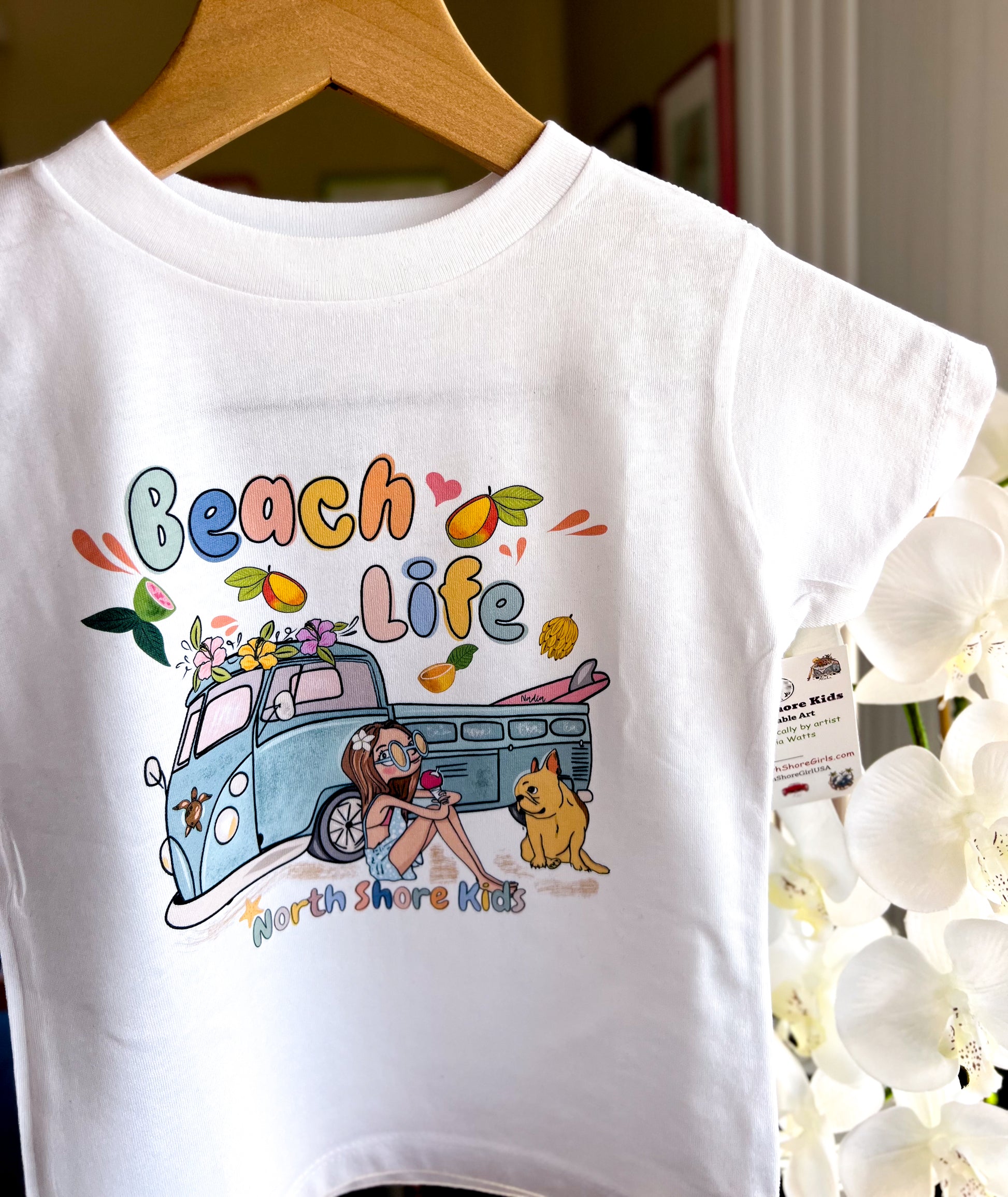 Graphic tee featuring a cute girl eating ice-cream, drooling frenchie and a surf truck. Beach Life illustrated tee for kids