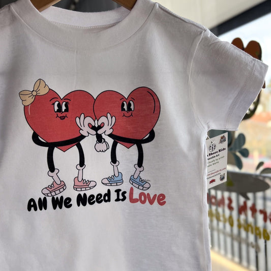two hearts holding hands and slogan " all we need is love" illustrated graphic t-shirt for kids