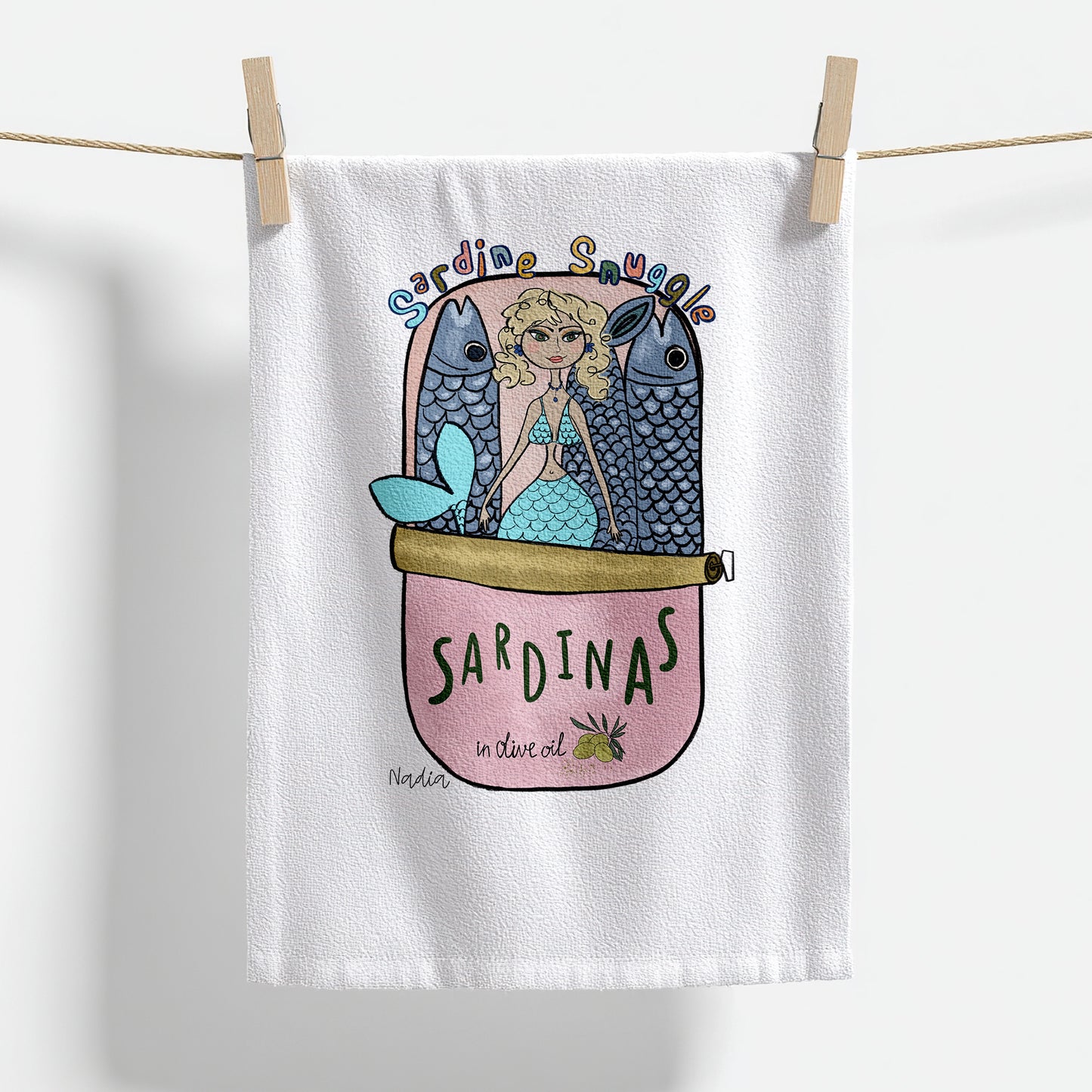18x28 inch white thin cotton kitchen towel with a mermaid in a pink sardine tin illustration signed by Nadia Watts