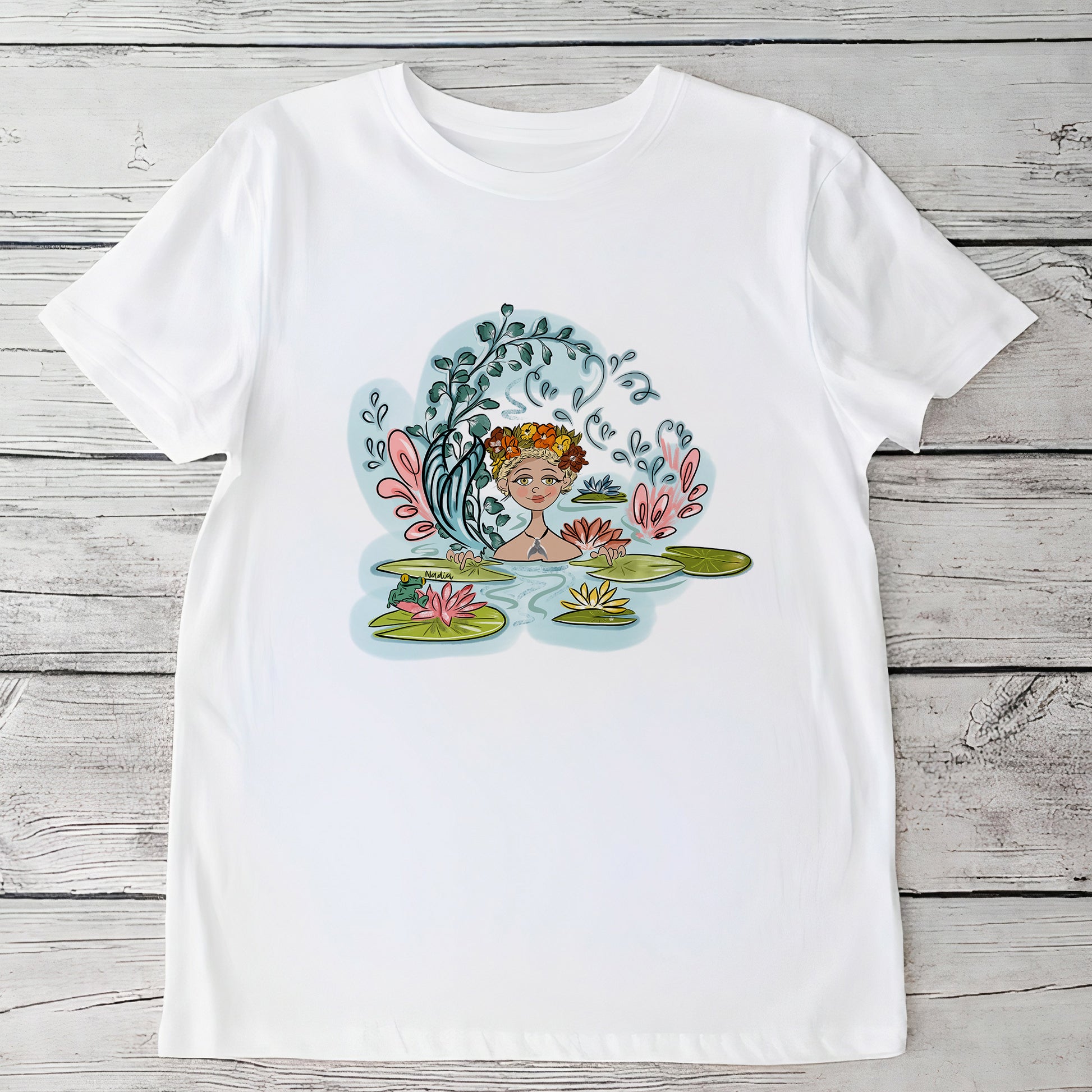 Youth white t-shirt featuring a hand-drawn mermaid with a floral wreath and tail among water lilies, North Shore Girls brand.