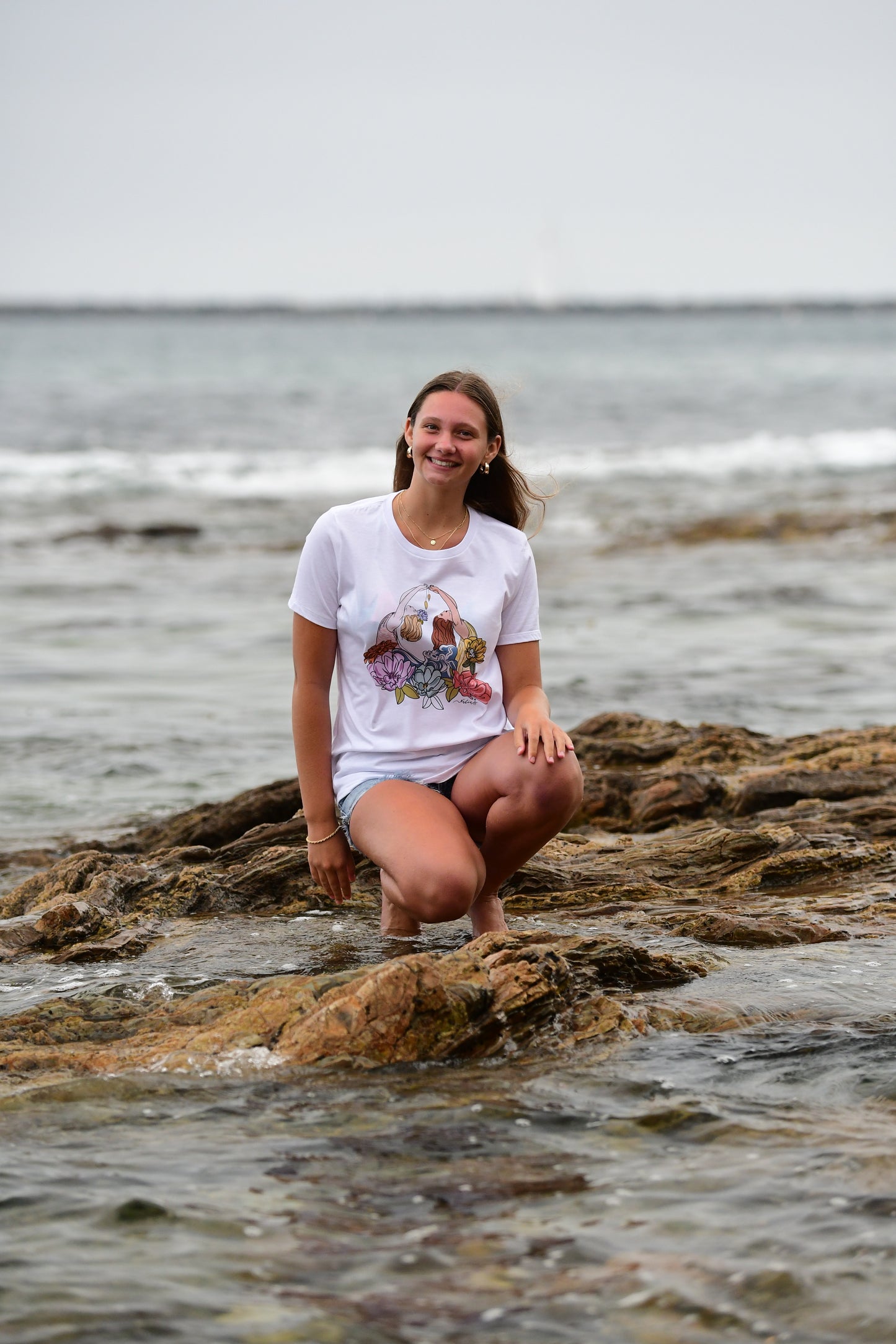 Load image into Gallery viewer, SEASTERS mermaids floral had-drawn graphic design artist&amp;#39;s t-shirt for women who like surfing, the beach and mermaids. Art by Nadia Watts
