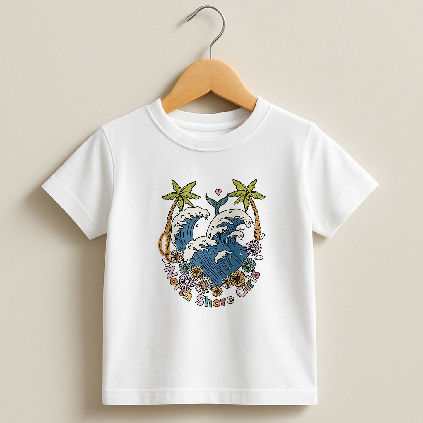 White toddler t-shirt featuring a hand-drawn ocean wave crest with palm trees and flowers, part of the North Shore Kids collection